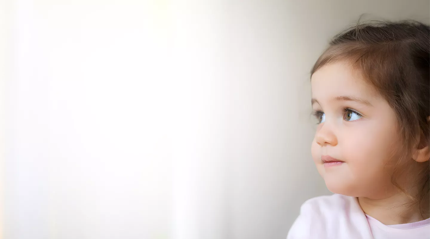 Young child gazing thoughtfully, capturing the curiosity and wonder of early childhood development